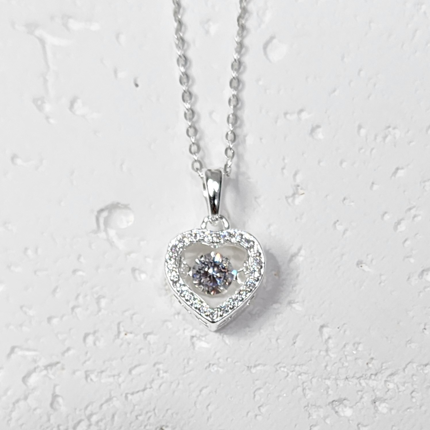 Sterling Silver Brilliant-Cut Moving Center Cubic Zirconia Heart Pendant and Sterling Silver Chain Sterling Silver Pendants Sterling Silver Brilliant-Cut Moving Center Cubic Zirconia Heart Pendant and Sterling Silver Chain Sterling Silver Pendants