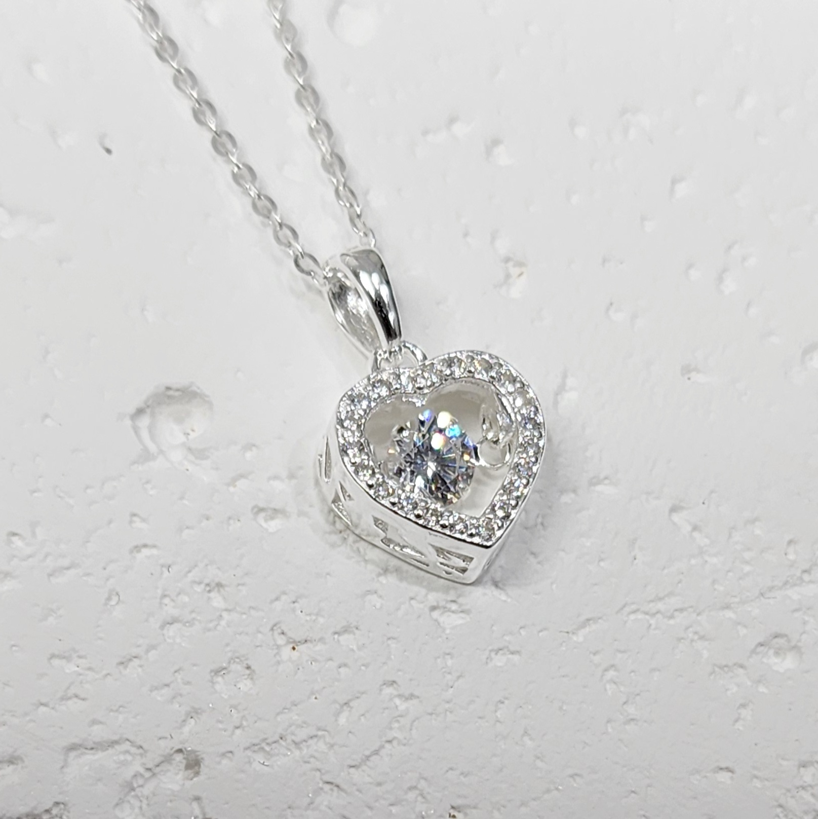 Sterling Silver Brilliant-Cut Moving Center Cubic Zirconia Heart Pendant and Sterling Silver Chain Sterling Silver Pendants 