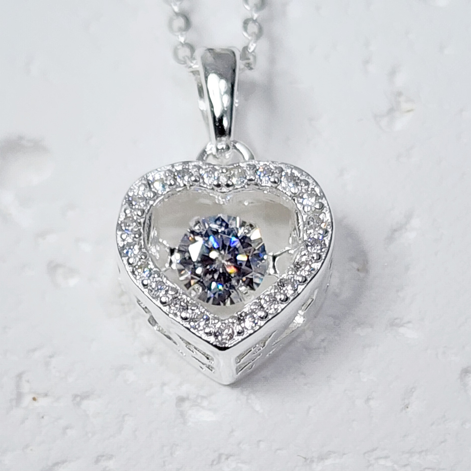 Sterling Silver Brilliant-Cut Moving Center Cubic Zirconia Heart Pendant and Sterling Silver Chain Sterling Silver Pendants Sterling Silver Brilliant-Cut Moving Center Cubic Zirconia Heart Pendant and Sterling Silver Chain Sterling Silver Pendants