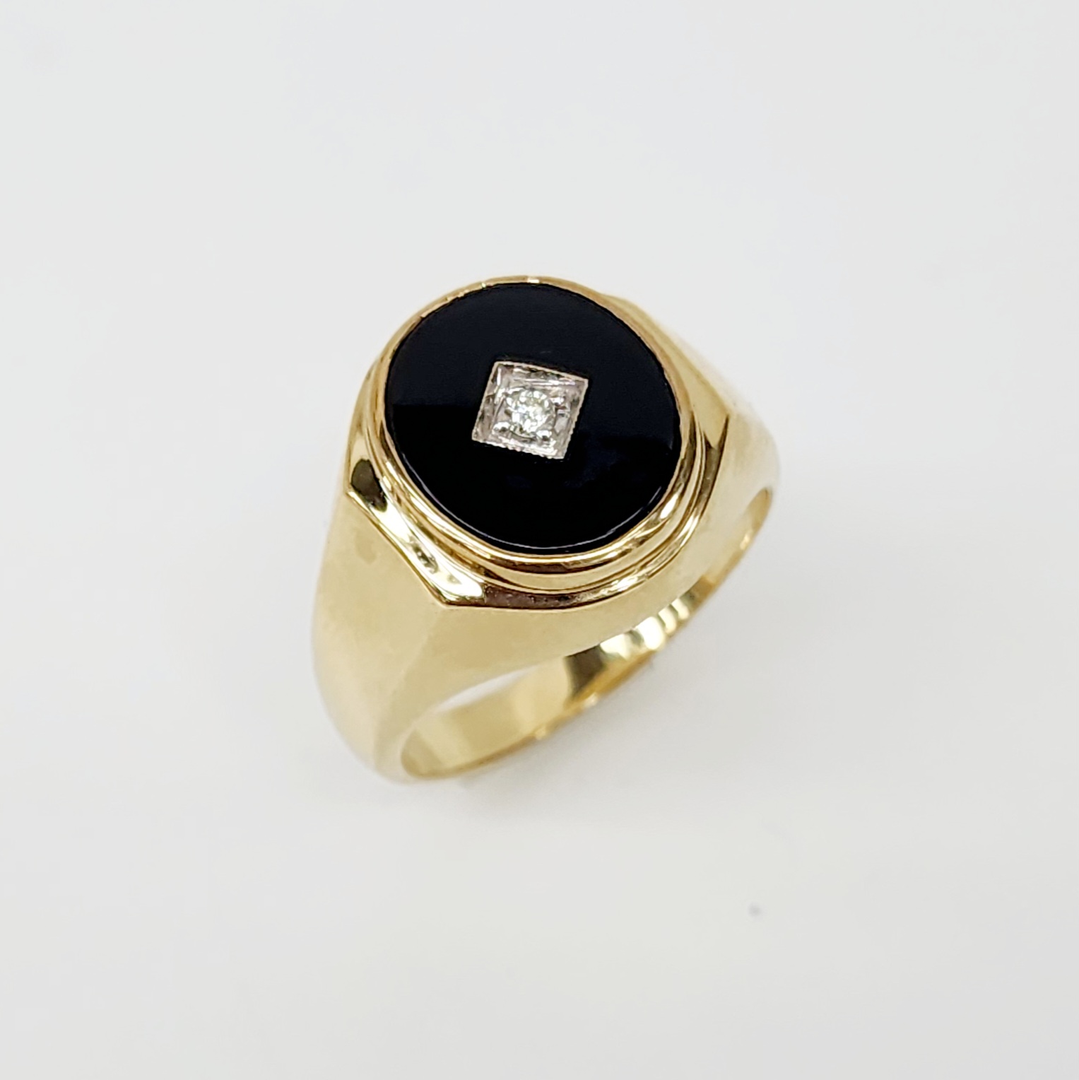 9ct Yellow Gold 14 x 12mm Oval Black Onyx and Diamond Gents Ring Gold Rings 9ct Yellow Gold 14 x 12mm Oval Black Onyx and Diamond Gents Ring Gold Rings