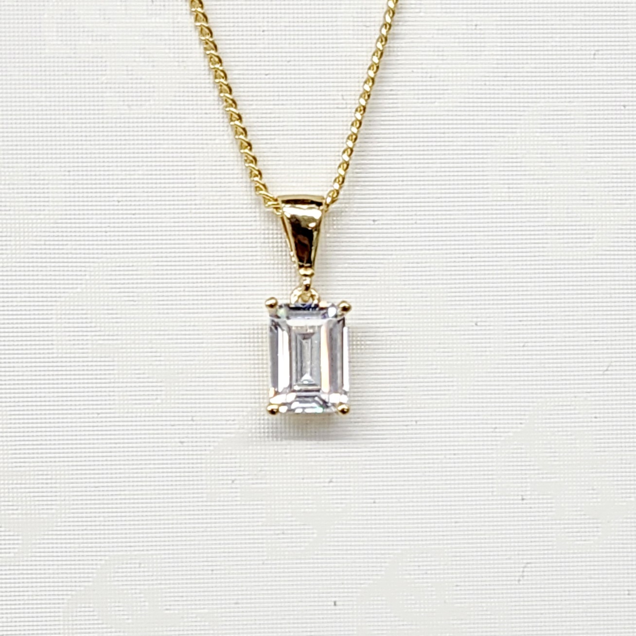 9ct Yellow Gold 5mm x 7.7mm Emerald Cut CZ 4 Claw Pendant Gold Bracelets 9ct Yellow Gold 5mm x 7.7mm Emerald Cut CZ 4 Claw Pendant Gold Bracelets