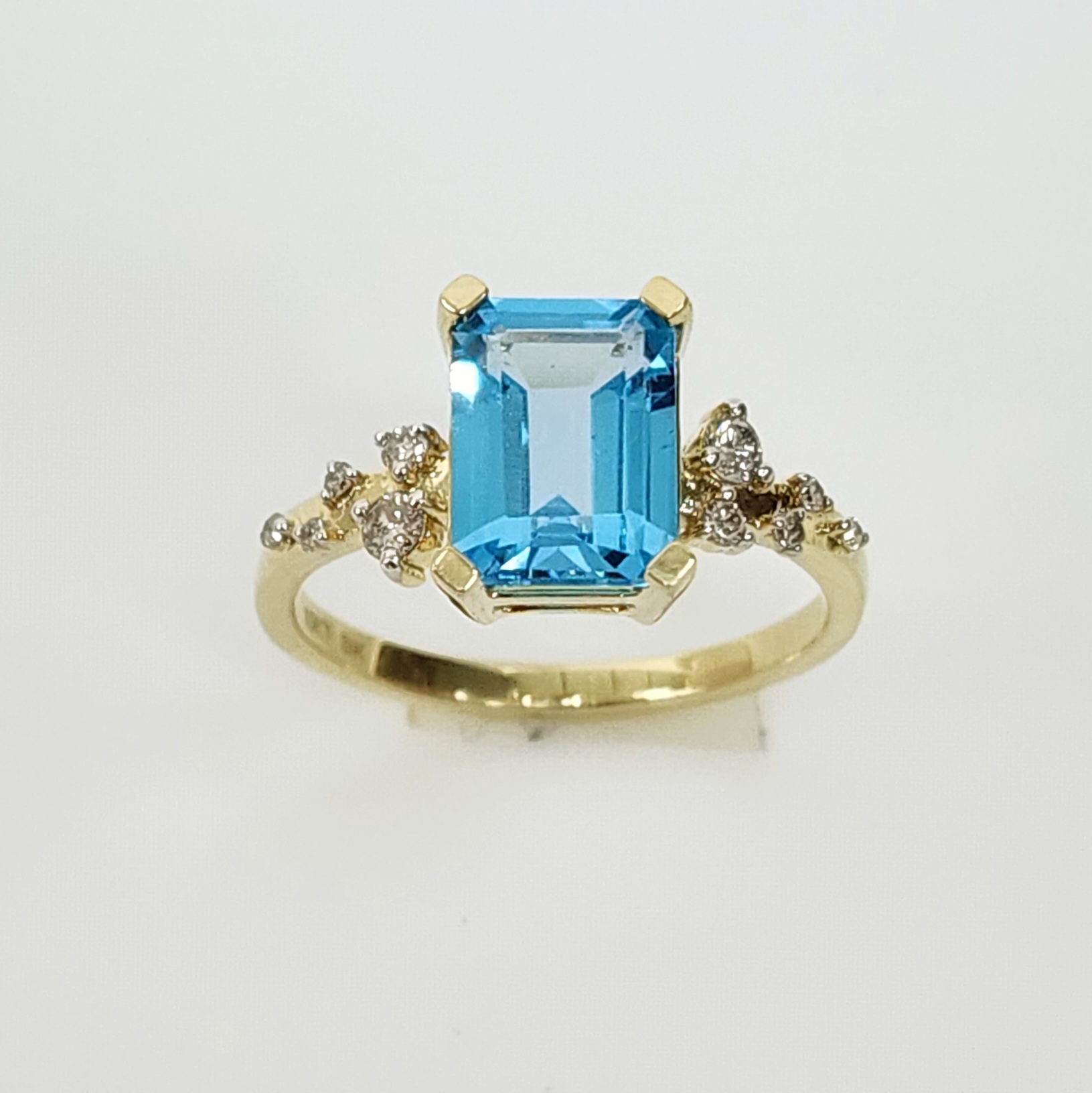 10ct Yellow Gold 0.15ct Diamond & 2.40ct Emerald Cut Blue Topaz Ring - SKR41115BT Gold Rings 10ct Yellow Gold 0.15ct Diamond & 2.40ct Emerald Cut Blue Topaz Ring - SKR41115BT Gold Rings