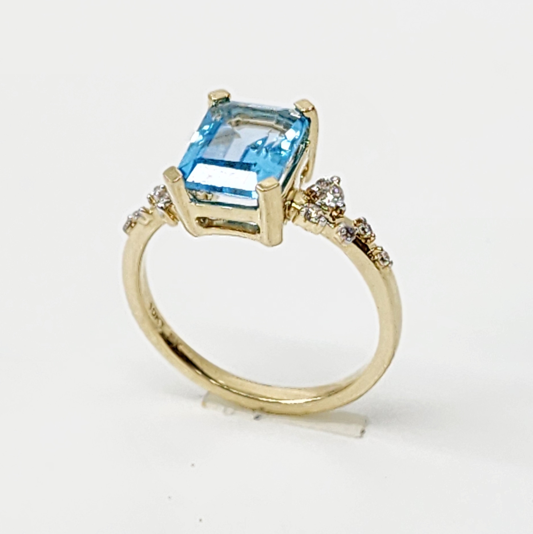 10ct Yellow Gold 0.15ct Diamond & 2.40ct Emerald Cut Blue Topaz Ring - SKR41115BT Gold Rings 10ct Yellow Gold 0.15ct Diamond & 2.40ct Emerald Cut Blue Topaz Ring - SKR41115BT Gold Rings